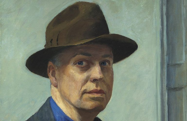 Edward Hopper dal volto solenne che indossa un cappello marrone.